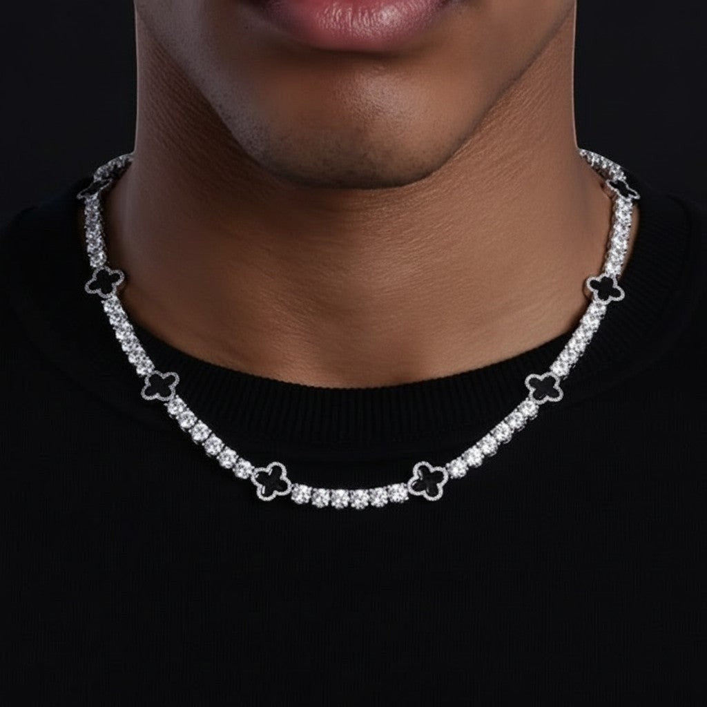 Gabrion white gold plated sterling silver tennis necklace with VVS moissanite stones and clover charms.