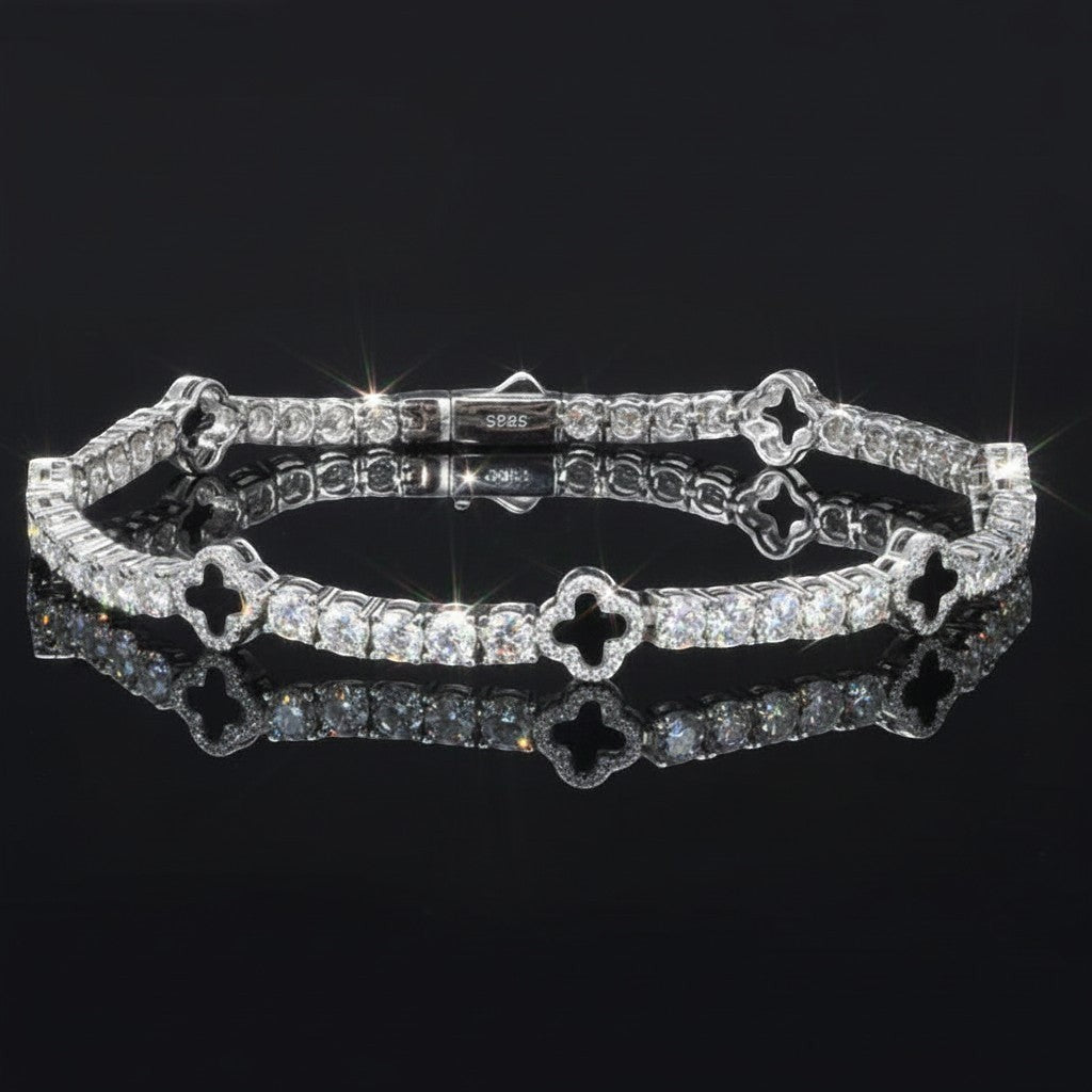 Gabrion white gold plated 925 sterling silver tennis bracelet with VVS moissanite stones and clover charms.