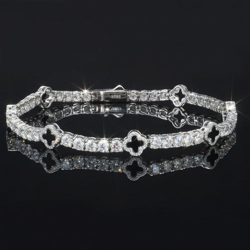Gabrion white gold plated 925 sterling silver tennis bracelet with VVS moissanite stones and clover charms.